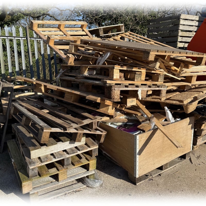 A Large Pile Of Broken Wooden Pallets